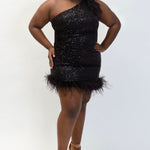 This is JK2401 in our collection Johnathan Kayne for Sydney's Closet. This plus size party dress comes in blue, red, black and white. This dress is one shoulder, all over sequins, an asymmetrical skirt, and has a feather hem.