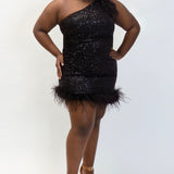 This is JK2401 in our collection Johnathan Kayne for Sydney's Closet. This plus size party dress comes in blue, red, black and white. This dress is one shoulder, all over sequins, an asymmetrical skirt, and has a feather hem.