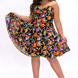 JK2501 onyx black short party dress.  Strapless, sweetheart neckline, basque waistline, pockets and flowy A-line skirt.  Unique bright colored sequin floral fabric.  Long invisible center back zipper.  Johnathan Kayne for Sydney's Closet