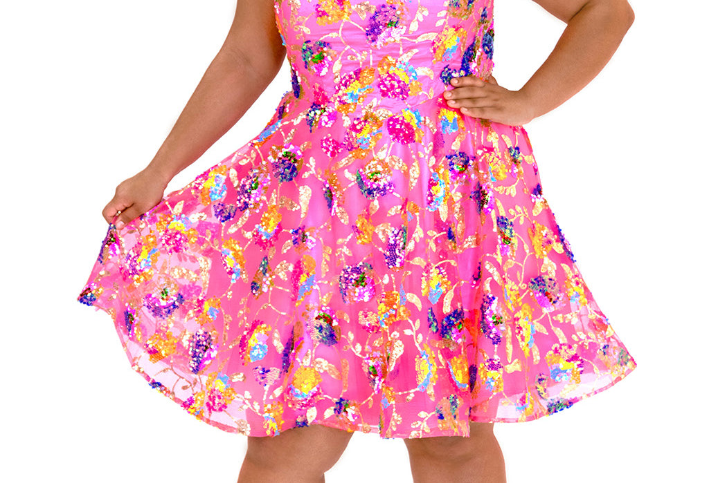 JK2501 bubblegum pink short party dress.  Strapless, sweetheart neckline, basque waistline, pockets and flowy A-line skirt.  Unique bright colored sequin floral fabric.  Long invisible center back zipper.  Johnathan Kayne for Sydney's Closet