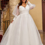 Michelle Bridal MB2429 Ivory. Bridal tulle, bridal tulle, Satin lining,  Appliques = Embroidered lace appliques, Guipure Lace trim, Silhouette: A-line, V-neckline, Ivory mesh insert Detachable, Puff Sleeve = long sleeve with cuff, Front bodice is lined, Back bodice has optional lining with snaps, Natural waistline.