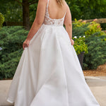 Michelle Bridal by Sydney's Closet plus size curvy wedding gowns. Floral leaf embroidery over satin on bodice on front and back. A-line skirt with pockets and long train.  Optional lining on back bodice included. Style MB2520