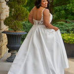 Michelle Bridal by Sydney's Closet plus size curvy wedding gowns. Floral leaf embroidery over satin on bodice on front and back. A-line skirt with pockets and long train.  Optional lining on back bodice included. Style MB2520