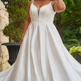 Michelle Bridal by Sydney's Closet plus size curvy wedding gowns. Floral leaf embroidery over satin on bodice on front and back. A-line skirt with pockets and long train.  Optional lining on back bodice included. Style MB2520