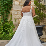 Michelle Bridal style MB2521 is available in ivory or ivory/champagne in plus sizes 14-40.  Square neckline, 1 inch illusion straps covered in leaf lace applqiues. A-line skirt with long train and optional bodice lining included.