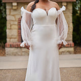 Sophisticated and sexy plus size simple crepe wedding dress with detachable puff sleeves.  Plain crepe slim front with sweetheart neckline and natural waist.  Optional lining included for the back bodice with criss-cross exposed boning.  Michelle Bridal by Sydney's Closet style MB2522