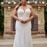 Sophisticated and sexy plus size simple crepe wedding dress with detachable puff sleeves.  Plain crepe slim front with sweetheart neckline and natural waist.  Optional lining included for the back bodice with criss-cross exposed boning.  Michelle Bridal by Sydney's Closet style MB2522