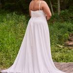 Sydney's Closet plus size wedding dress with sweetheart neckline,spaghetti straps and flowing chiffon skirt with slit. Lace covered bodice comes unlined with optional lining included. Style SC5348 is avialable in ivory