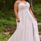 Sydney's Closet plus size wedding dress with sweetheart neckline,spaghetti straps and flowing chiffon skirt with slit. Lace covered bodice comes unlined with optional lining included. Style SC5348 is avialable in ivory