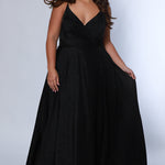 Sydney's Closet SC7375 Black. Aline silhouette, Stretch jersey with sparkle over stretch knit lining, V-neckline, Spaghetti straps, Natural waistline, Aline skirt with pockets.