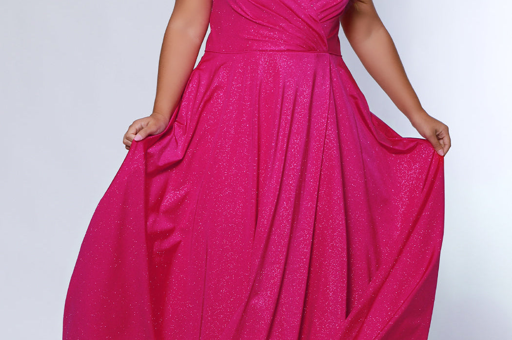 Sydney's Closet SC7375 Pink. Aline silhouette, Stretch jersey with sparkle over stretch knit lining, V-neckline, Spaghetti straps, Natural waistline, Aline skirt with pockets.