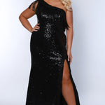 Sydney's Closet SC7391 Black. One shoulder, embroidered gold detail on slit and neckline, fringe off high point of shoulder, center back zipper.
