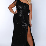 Sydney's Closet SC7391 Black. One shoulder, embroidered gold detail on slit and neckline, fringe off high point of shoulder, center back zipper.