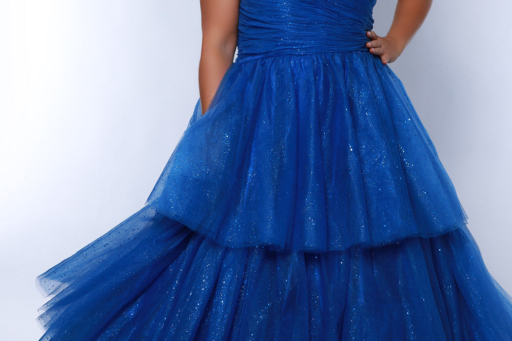 Sydney's Closet SC7392 Royal. Tiered glitter tulle ballgown, pleated bodice, rolled satin straps covered in glitter tulle, natural waistline, center back zipper.