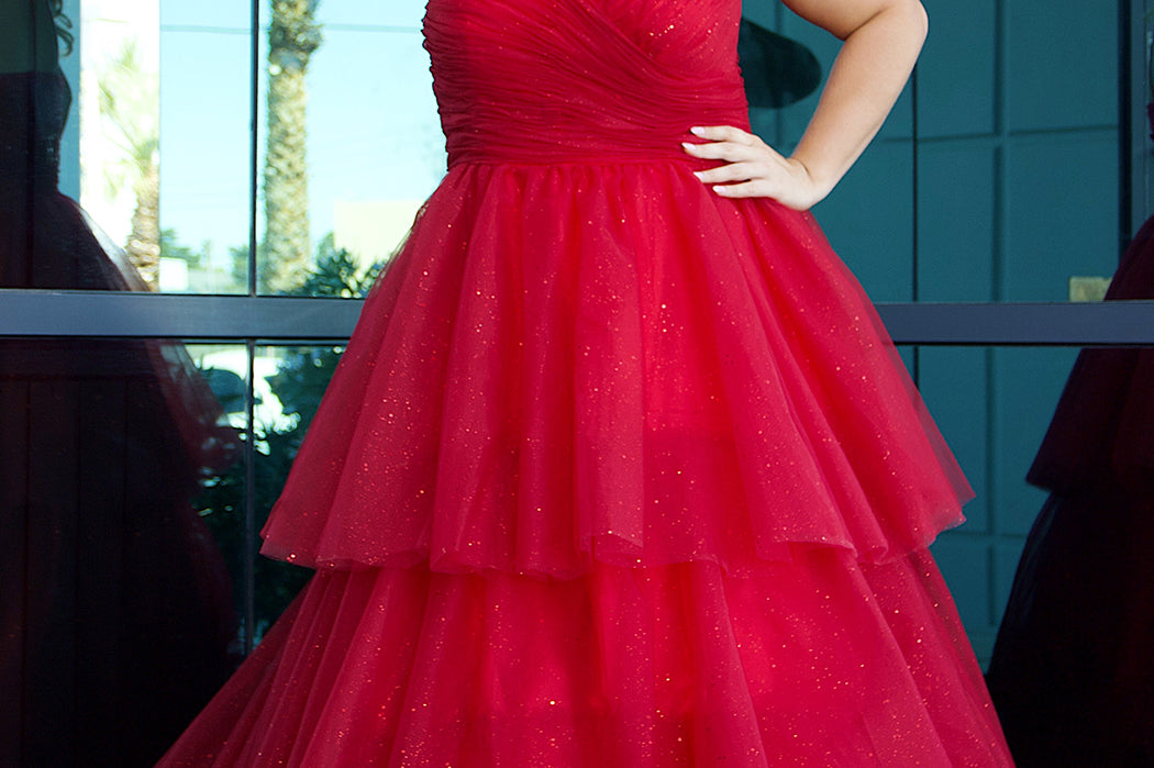 Sydney's Closet SC7392 Red. Tiered glitter tulle ballgown, pleated bodice, rolled satin straps covered in glitter tulle, natural waistline, center back zipper.