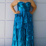 SC7405 by Sydney's Closet. Plus size strapless sweetheart metallic knit gown with exposed boning on bodice.  Tiered A-line skirt slit. Available in magenta pink, copper gold/brown and turq blue green.
