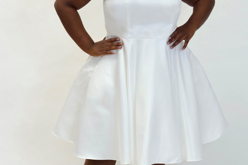 Sydney's Closet CE2401 White. A-line silhouette, Scoop neckline polyester satin. Short party dress with pockets