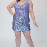 Short fitted lilac purple party dress SC8145 by Sydney's Closet. Front view.  Fully sequined short gown, with 3D floral embellishments on bodice. Thick bra-friendly straps, deep v-neckline. Long invisible center back zipper. Availability in lilac purple, onyx black and ruby red . Model in picture is 5'9.