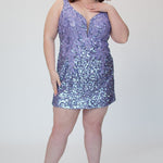 Short fitted lilac purple party dress SC8145 by Sydney's Closet. Front view.  Fully sequined short gown, with 3D floral embellishments on bodice. Thick bra-friendly straps, deep v-neckline. Long invisible center back zipper. Availability in lilac purple, onyx black and ruby red . Model in picture is 5'9.
