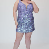 Short fitted lilac purple party dress SC8145 by Sydney's Closet. Front view.  Fully sequined short gown, with 3D floral embellishments on bodice. Thick bra-friendly straps, deep v-neckline. Long invisible center back zipper. Availability in lilac purple, onyx black and ruby red . Model in picture is 5'9.