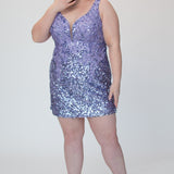 Short fitted Lilac party dress SC8145 by Sydney's Closet. Front view.  Fully sequined short gown, with 3D floral embellishments on bodice. Thick bra-friendly straps, deep v-neckline. Long invisible center back zipper. Availability in lilac purple, onyx black and ruby red . Model in picture is 5'9.