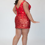 Short fitted Ruby red party dress SC8145 by Sydney's Closet. Back view.  Fully sequined short gown, with 3D floral embellishments on bodice. Thick bra-friendly straps, deep v-neckline. Long invisible center back zipper. Availability in lilac purple, onyx black and ruby red . Model in picture is 5'9.
