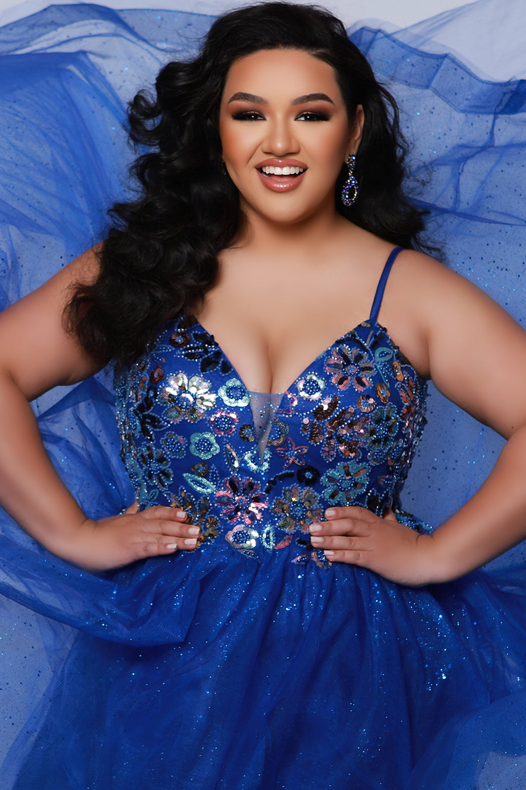 Tease Prom TE2427 Blue. A-line silhouette, Sequin, beaded floral fabric on net, sparkle tulle Spaghetti straps, V-neckline, Tone-on-tone sparkle mesh insert, Slight scoop with V-back, Long invisible center back zipper, Natural waistline, Gathered A-line skirt with horsehair hem.