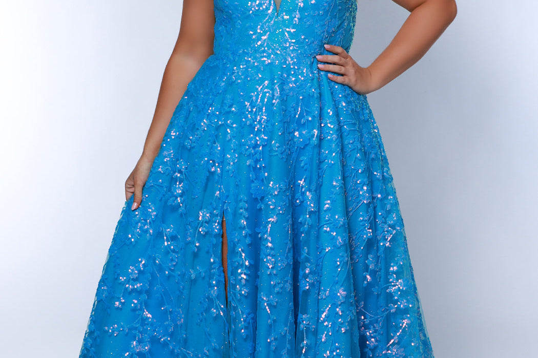 Tease Prom TE2433 blue, Plus size A-line dress with iridescent blue sequins, v-neck, sequin covered straps, slit, bicep to wrist puff sleeves.