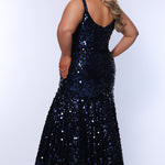 Fitted mermaid plus size prom dress.  Sequin and piette fabric with stretch knit linight. Deep v-neckline with nude mesh insert and spaghetti straps. Mermaid fitted skirt. Available in midnight navy blue and hot magenta pink. TE2512 by Tease Prom.