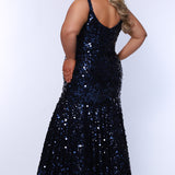 Fitted mermaid plus size prom dress.  Sequin and piette fabric with stretch knit linight. Deep v-neckline with nude mesh insert and spaghetti straps. Mermaid fitted skirt. Available in midnight navy blue and hot magenta pink. TE2512 by Tease Prom.