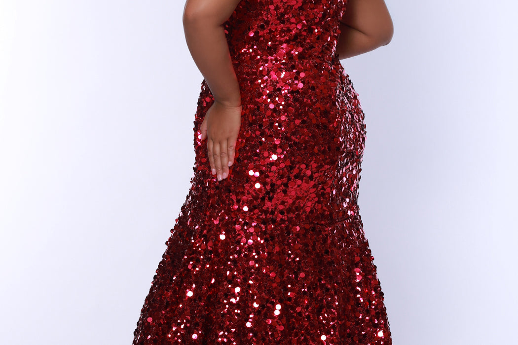 Fitted mermaid plus size prom dress.  Sequin and piette fabric with stretch knit linight. Deep v-neckline with nude mesh insert and spaghetti straps. Mermaid fitted skirt. Available in midnight navy blue and hot magenta pink. TE2512 by Tease Prom.