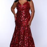 Fitted mermaid plus size prom dress.  Sequin and piette fabric with stretch knit linight. Deep v-neckline with nude mesh insert and spaghetti straps. Mermaid fitted skirt. Available in midnight navy blue and hot magenta pink. TE2512 by Tease Prom.