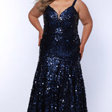 Fitted mermaid plus size prom dress.  Sequin and piette fabric with stretch knit linight. Deep v-neckline with nude mesh insert and spaghetti straps. Mermaid fitted skirt. Available in midnight navy blue and hot magenta pink. TE2512 by Tease Prom.