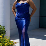 Sexy plus size fitted prom dress with double spaghetti straps, pleated bodice with optional bodice lining.  Exposed boning with hot fix stones on basque waistline.  Slim fitted skirt with ruching. High slit filled in with mesh and hot fix stones. Tease Prom style TE2516 avialable in berry, forest and navy.