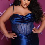 Sexy plus size fitted prom dress with double spaghetti straps, pleated bodice with optional bodice lining.  Exposed boning with hot fix stones on basque waistline.  Slim fitted skirt with ruching. High slit filled in with mesh and hot fix stones. Tease Prom style TE2516 avialable in berry, forest and navy.