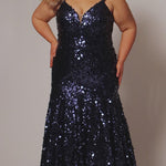 Fitted mermaid plus size prom dress.  Sequin and piette fabric with stretch knit linight. Deep v-neckline with nude mesh insert and spaghetti straps. Mermaid fitted skirt. Available in midnight navy blue and hot magenta pink. TE2512 by Tease Prom.