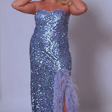 Tease Prom TE2419 Blue. Stretch sequin on net, Stretch knit lining, Sweetheart neckline, Strapless bodice, Natural waistline, Slim skirt with slit trimmed in Ostrich feathers, Sweep train.