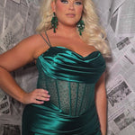 Sexy plus size fitted prom dress with double spaghetti straps, pleated bodice with optional bodice lining.  Exposed boning with hot fix stones on basque waistline.  Slim fitted skirt with ruching. High slit filled in with mesh and hot fix stones. Tease Prom style TE2516 avialable in berry, forest and navy.