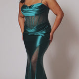 Sexy plus size fitted prom dress with double spaghetti straps, pleated bodice with optional bodice lining.  Exposed boning with hot fix stones on basque waistline.  Slim fitted skirt with ruching. High slit filled in with mesh and hot fix stones. Tease Prom style TE2516 avialable in berry, forest and navy.