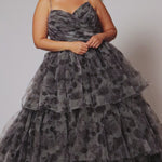Best selling plus size floral tiered ballgown dress style TE2525 by Tease Prom.  Double spaghetti straps on pleated V-neckline bodice with tiered ball gown skirt in floral print tulle. Available in black floral or blue floral in sizes 14-32.