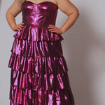 SC7405 by Sydney's Closet. Plus size strapless sweetheart metallic knit gown with exposed boning on bodice.  Tiered A-line skirt slit. Available in magenta pink, copper gold/brown and turq blue green.