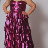 SC7405 by Sydney's Closet. Plus size strapless sweetheart metallic knit gown with exposed boning on bodice.  Tiered A-line skirt slit. Available in magenta pink, copper gold/brown and turq blue green.