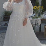 Michelle Bridal MB2308 Ivory. Soft bridal tulle, 3D floral lace appliques, A-line silhouette, Scoop neckline, Detachable pouf sleeve with lace and zipper on cuff included, Scoop back, Long invisible center back zipper, Full A-line skirt with 3D lace appliques on front and back.