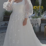 Michelle Bridal MB2308 Ivory. Soft bridal tulle, 3D floral lace appliques, A-line silhouette, Scoop neckline, Detachable pouf sleeve with lace and zipper on cuff included, Scoop back, Long invisible center back zipper, Full A-line skirt with 3D lace appliques on front and back.