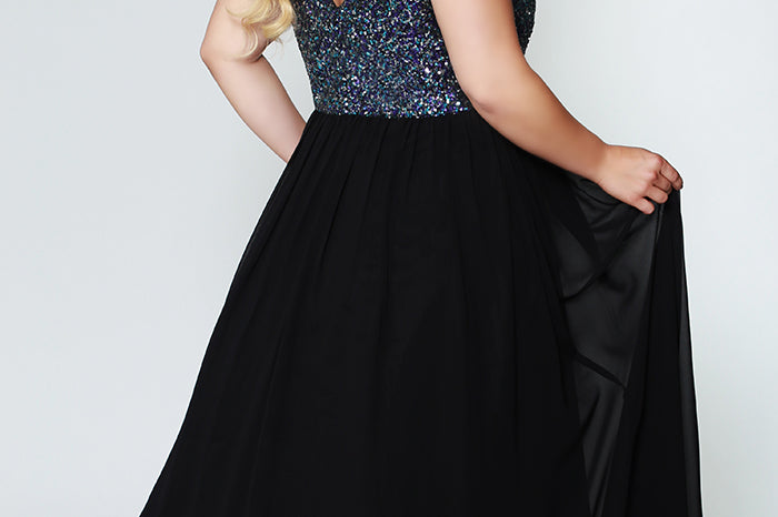 CE1813  has a V-neckline with illusion mesh net is heavily beaded and sequined on front and back. The dress is fully lined, with an A-line chiffon skirt. It's sleeveless, with bra-friendly straps