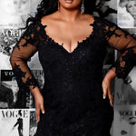 Michelle Bridal MB2202 Editorial shot of model in black fitted mermaid dress with v-neckline with black lace on bodice and sleeves.