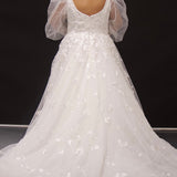 Michelle Bridal MB2308 Ivory. Soft bridal tulle, 3D floral lace appliques, A-line silhouette, Scoop neckline, Detachable pouf sleeve with lace and zipper on cuff included, Scoop back, Long invisible center back zipper, Full A-line skirt with 3D lace appliques on front and back.