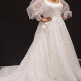 Michelle Bridal MB2308 Ivory. Soft bridal tulle, 3D floral lace appliques, A-line silhouette, Scoop neckline, Detachable pouf sleeve with lace and zipper on cuff included, Scoop back, Long invisible center back zipper, Full A-line skirt with 3D lace appliques on front and back.