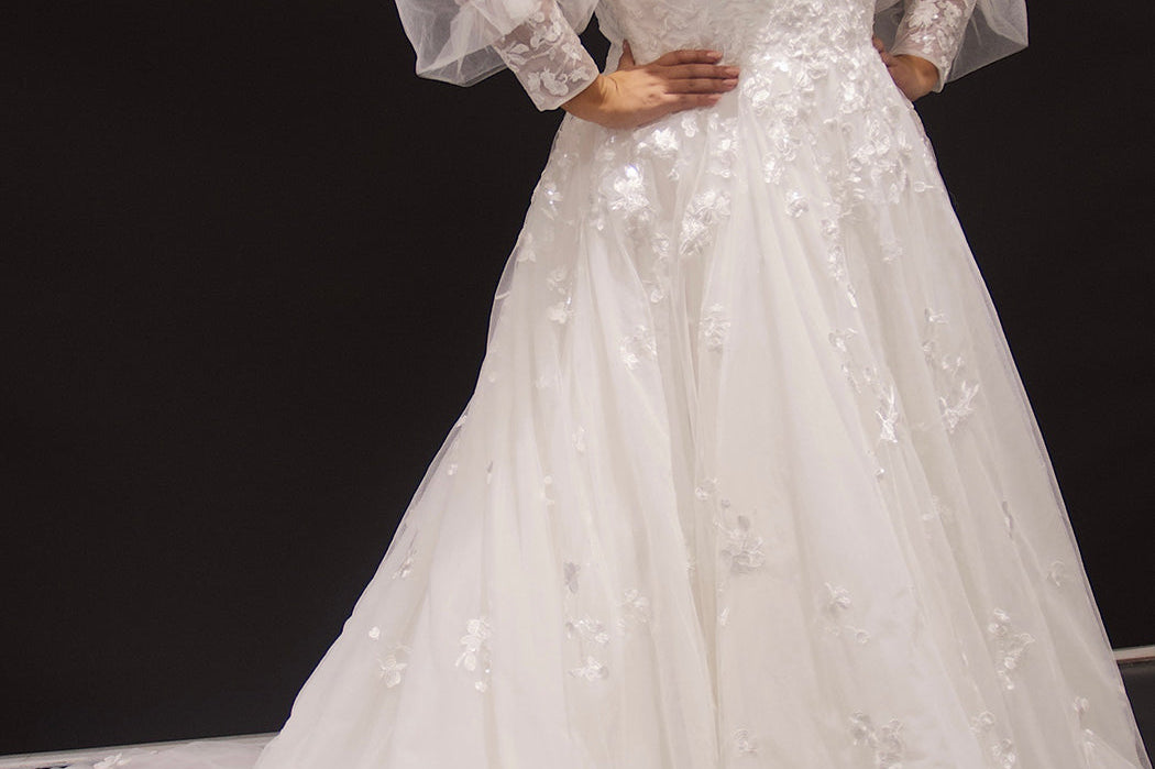Michelle Bridal MB2308 Ivory. Soft bridal tulle, 3D floral lace appliques, A-line silhouette, Scoop neckline, Detachable pouf sleeve with lace and zipper on cuff included, Scoop back, Long invisible center back zipper, Full A-line skirt with 3D lace appliques on front and back.