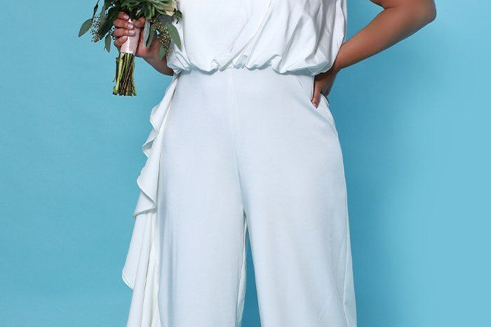 SC5244 Shania Jumpsuit by Sydney's Closet French Crepe fabric bra friendly sleeveless flounce on side of bodice and pant center back zipper available in Ivory